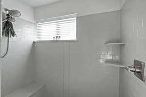 Full bathroom featuring tiled shower