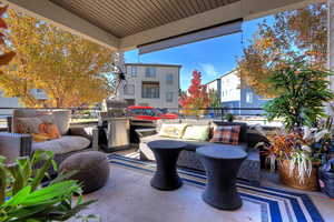 Balcony with outdoor lounge area and a grill