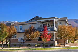View of front facade with a mountain view and brick siding
