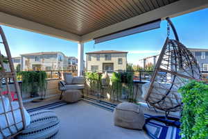 Balcony with a sunroom and a residential view