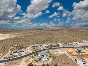 Overview of rural landscape featuring a desert landscape and nearby suburban area