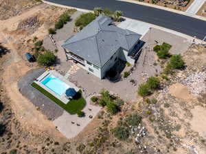 Aerial view of property and surrounding area featuring a pool area