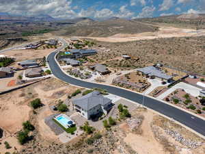 Aerial perspective of suburban area with a mountainous background and a desert landscape