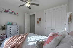 Bedroom with a closet and ceiling fan