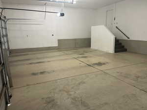 Garage featuring a garage door opener