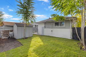View of yard with a storage unit