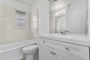 Full bathroom with vanity and  shower combination