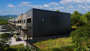 View of side of property featuring a mountain view