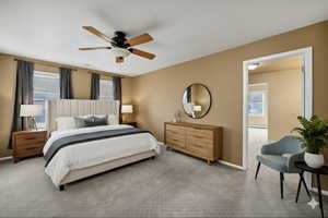 Virtually Staged Carpeted bedroom featuring multiple windows and a ceiling fan