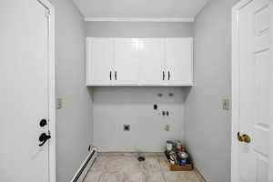 Washroom featuring washer hookup, cabinet space, a baseboard radiator, hookup for an electric dryer, and light tile patterned flooring