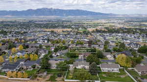 Aerial perspective of suburban area featuring mountains and property boundaries highlighted