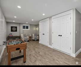 Virtually Staged Game room with recessed lighting and light wood finished floors