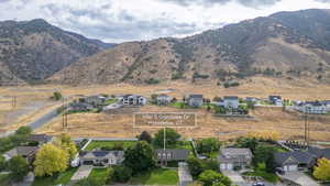 View of mountain backdrop with nearby suburban area