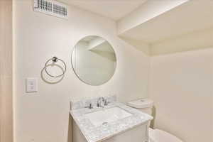 Bathroom with vanity and toilet