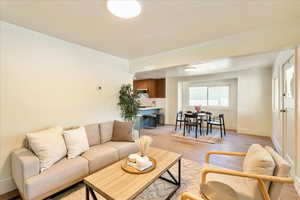 Living room with light wood finished floors and baseboards