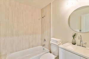 Full bath with vanity and shower / bath combination