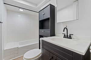Full bathroom with vanity, light tile patterned flooring, and shower / bathtub combination