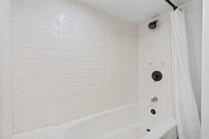 Full bathroom featuring shower / bath combo