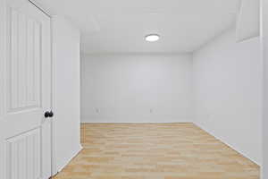Spare room with light wood finished floors and baseboards