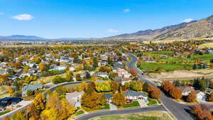 Aerial view of residential area featuring a mountain backdrop