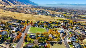 View of property location featuring nearby suburban area and a mountain backdrop