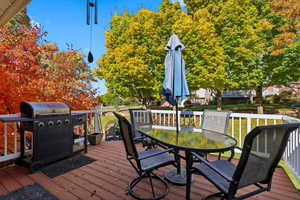 Deck with grilling area and outdoor dining space