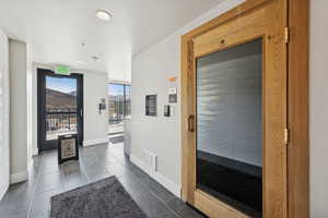 Corridor featuring a sauna