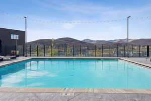 Community pool featuring a mountain view