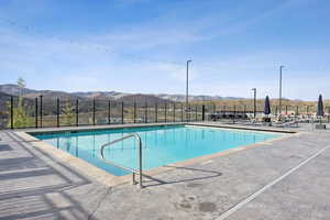 Community pool with a mountain view