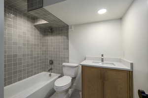 Full bathroom with shower / washtub combination and vanity