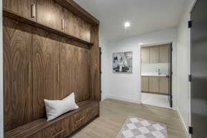 Mudroom featuring light wood-style floors and recessed lighting