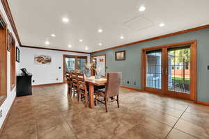 Dining area featuring recessed lighting, french doors, crown molding, and light tile patterned floors