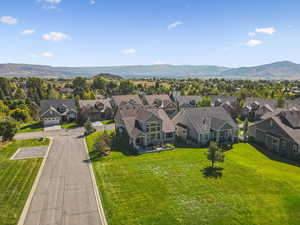 Aerial perspective of suburban area with a mountain backdrop