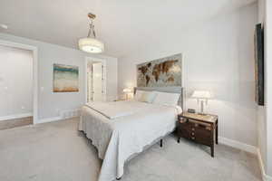 Carpeted bedroom with baseboards