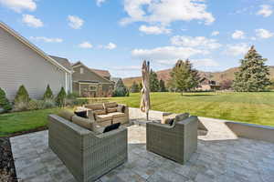 View of patio with outdoor lounge area and a mountain view