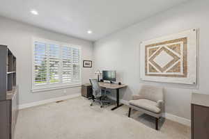 Office area featuring light carpet and recessed lighting