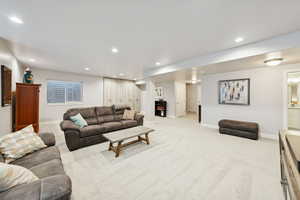 Living room featuring light carpet and recessed lighting