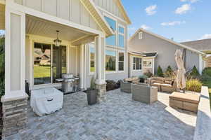 View of patio featuring a grill