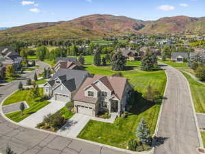 Aerial perspective of suburban area featuring a mountainous background