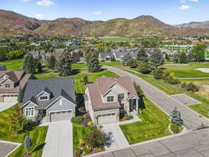 Aerial perspective of suburban area with a mountainous background