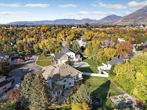 View of property location featuring mountains and nearby suburban area