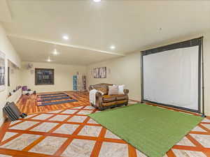 Playroom featuring inlaid floor details and recessed lighting