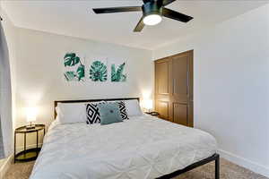 Bedroom featuring carpet flooring and ceiling fan