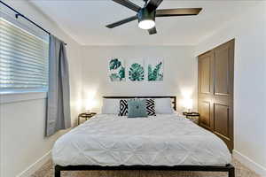 Bedroom with carpet and a ceiling fan