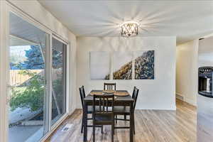Dining area with wood finished floors