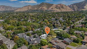 Aerial view of property and surrounding area with property parcel outlined and nearby suburban area