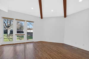 Empty room with recessed lighting, beamed ceiling, and dark wood-style flooring