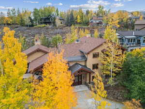 Aerial view of residential area featuring a tree filled landscape