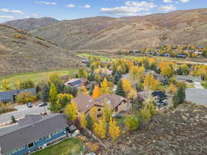 Aerial view of residential area featuring a mountainous background