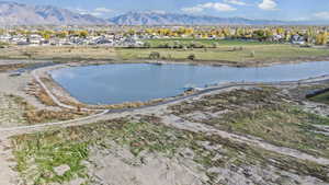 Aerial perspective of suburban area featuring a water and mountain view